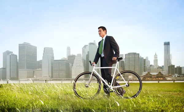 Businessman in suit with Bicycle — Stock Photo, Image