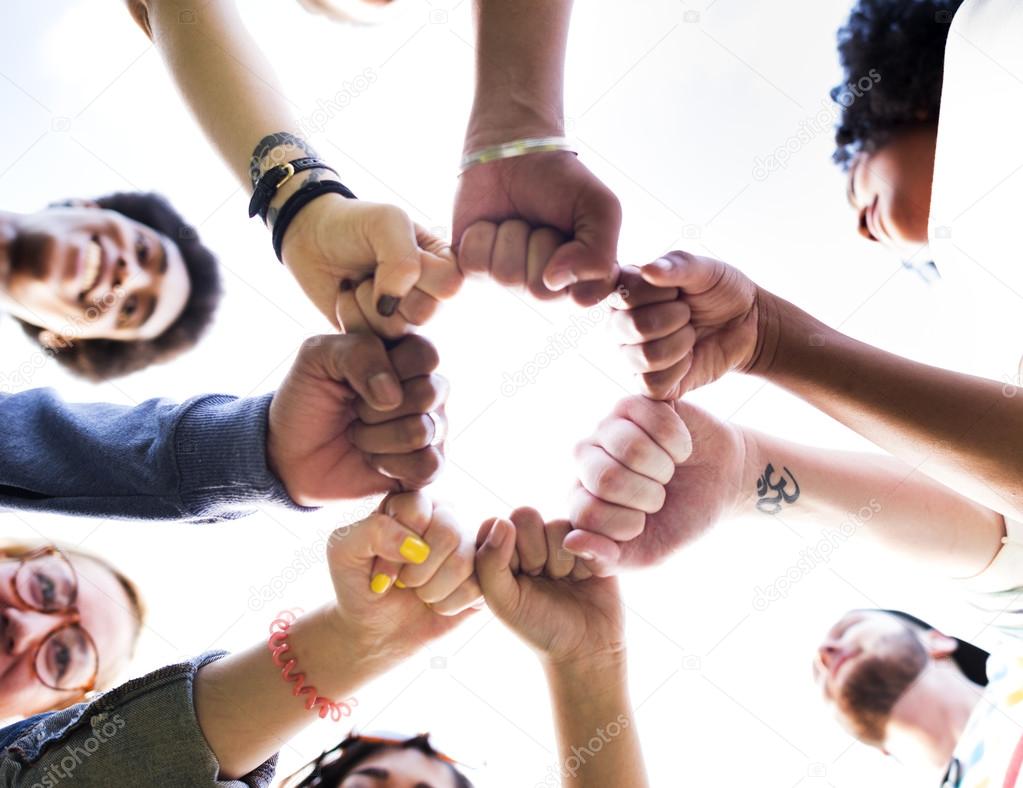 friends making fist bump gesture