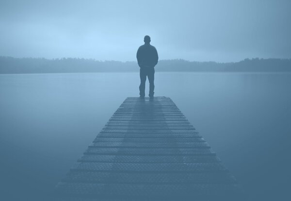 Man Standing at Jetty