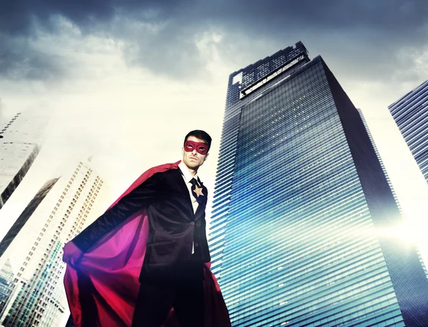 Superhero Businessman in modern city — Stock Photo, Image