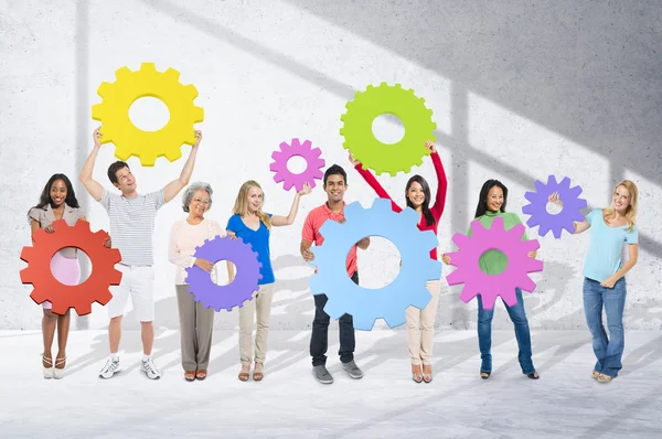 Diversity People holding Gears — Stock Photo, Image