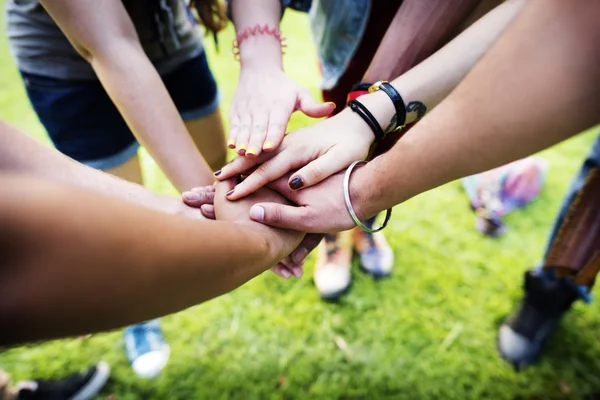 Young students making unity gesture — Stock Photo, Image