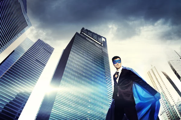 Superhero Businessman in modern city — Stock Photo, Image