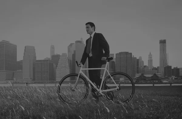 Businessman in suit with Bicycle — Stock Photo, Image