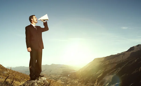 Businessman Shouting on Mountain — Stock Photo, Image