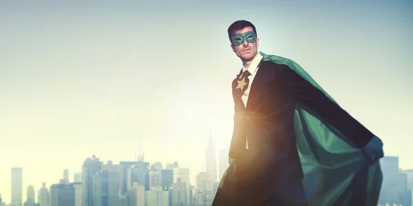 Superhero Businessman in modern city — Stock Photo, Image