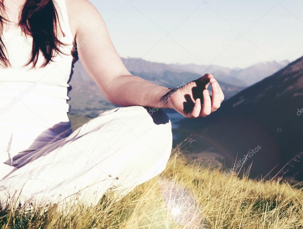 Lady meditating in lotus position