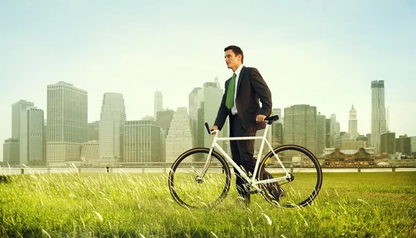 Businessman in suit with Bicycle — Stock Photo, Image