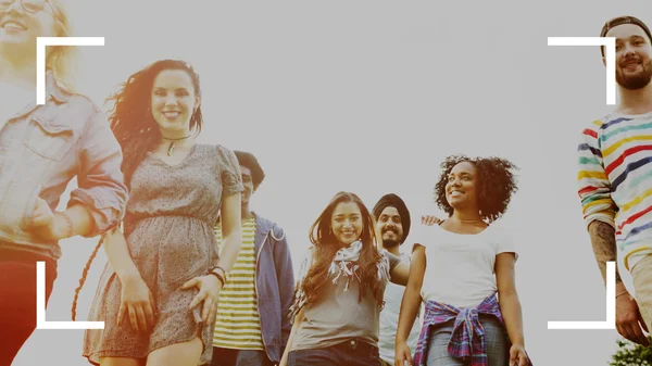 Cheerful students walking in college park — Stock Photo, Image