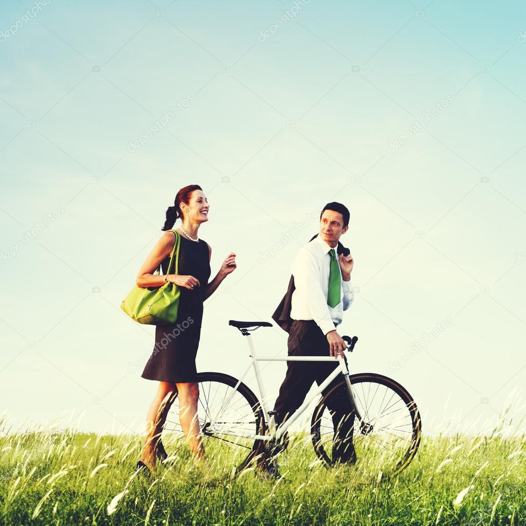 Business couple with bicycle