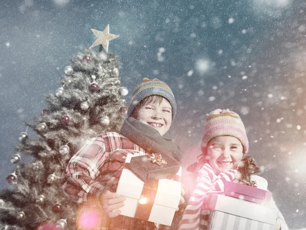 Christmas Children with Gifts — Stock Photo, Image