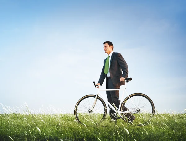 Businessman in suit with Bicycle — Stock Photo, Image