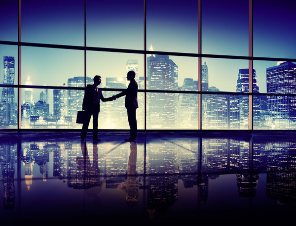 Businessmen meeting and handshake, work and buildings concept