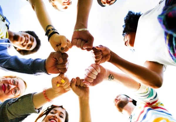 Happy friends making unity gesture — Stock Photo, Image