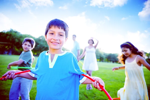 Happy family in park — Stock Photo, Image