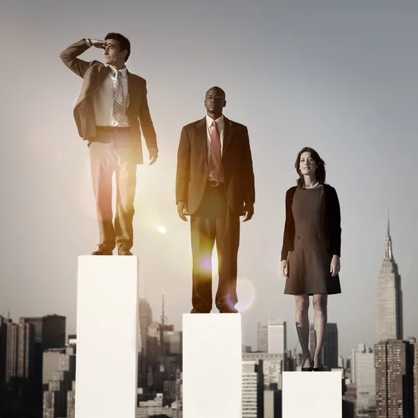 Business people standing on steps — Stock Photo, Image