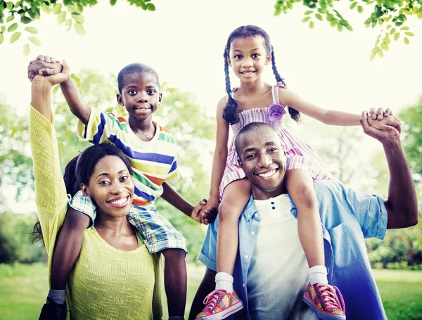 Happy African family in the park Stock Image