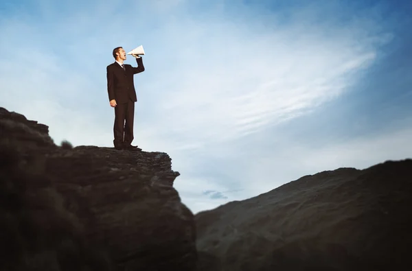 Businessman Shouting on Mountain — Stock Photo, Image