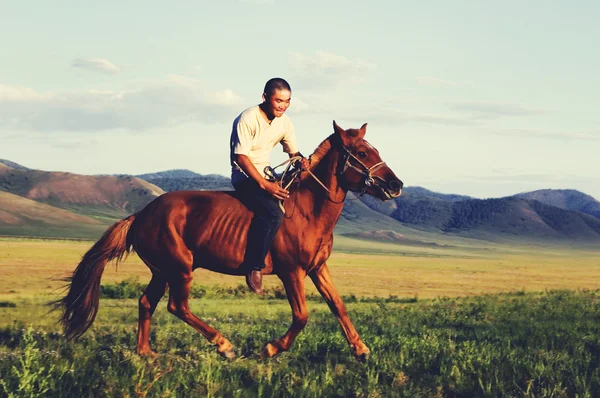Young man Riding Horse — Stock Photo, Image