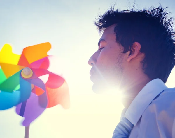 Businessman Blowing Wind mill Concept — Stock Photo, Image