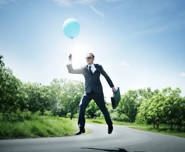 Empresário alegre com balão — Fotografia de Stock