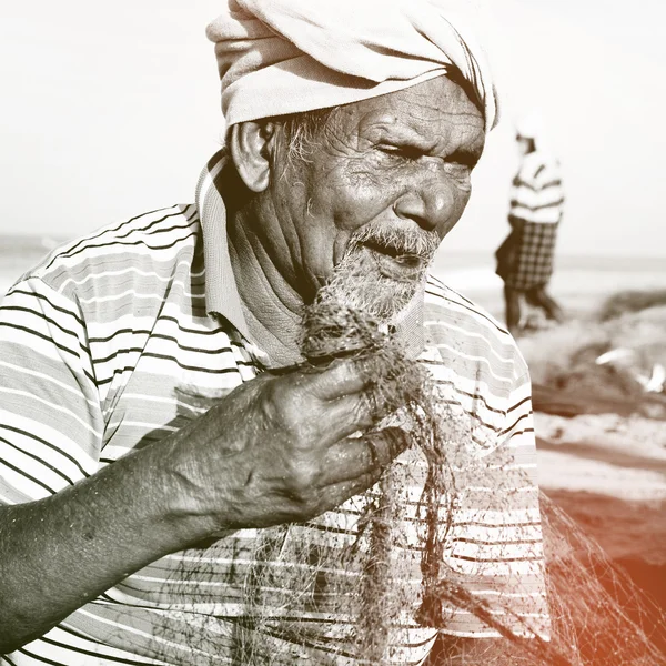 Fisherman holding net — Stock Photo, Image