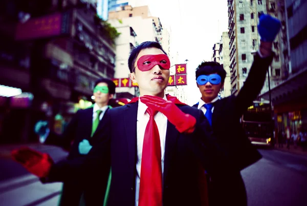 Businessmen in superhero masks — Stock Photo, Image