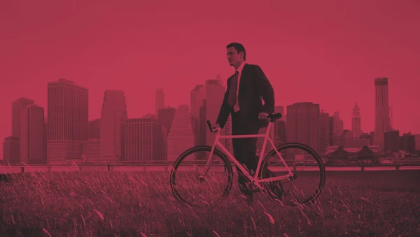 Businessman in suit with Bicycle — Stock Photo, Image