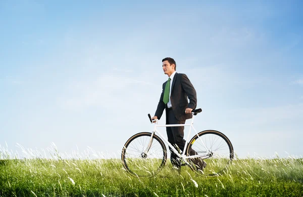 Businessman in suit with Bicycle — Stock Photo, Image