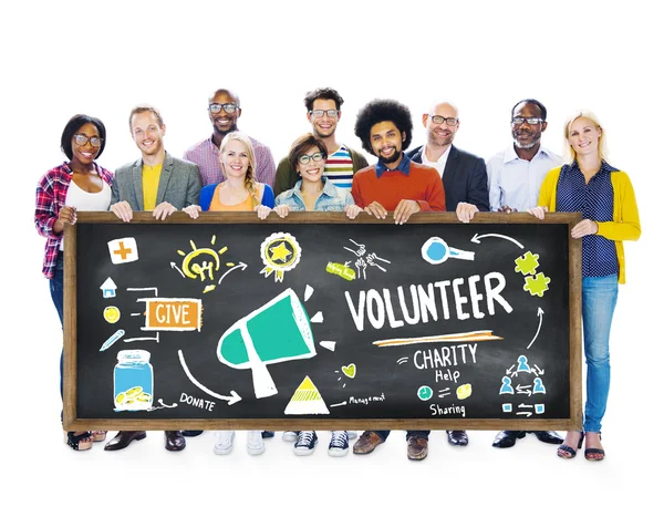 People holding banner with Volunteer