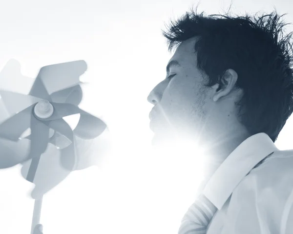 Businessman Blowing Windmill Concept — Stock Photo, Image