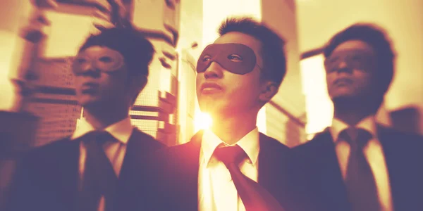 Businessmen in colorful superhero masks — Stock Photo, Image