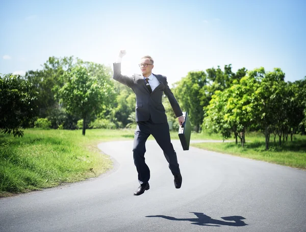 Joyful businessman with briefcase — Stock Photo, Image