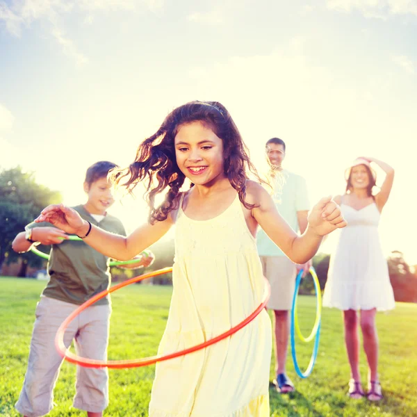 Girl with family in park — Stock Photo, Image