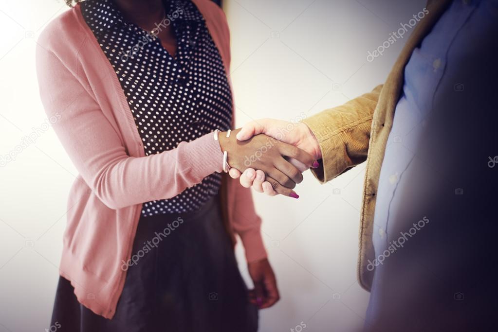 Business people handshaking to confirm deal