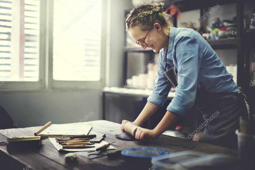 Woman Rolling Clay Concept