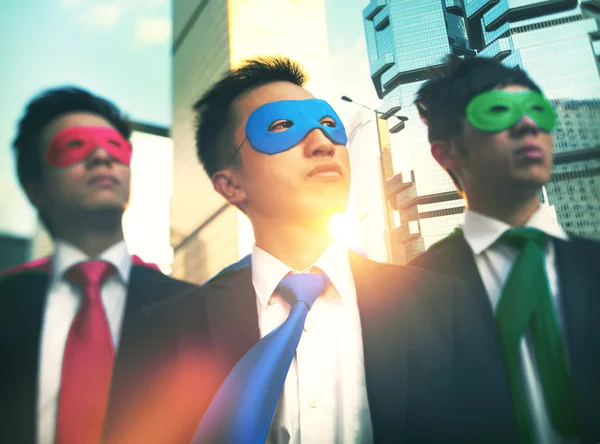 Businessmen in colorful superhero masks — Stock Photo, Image