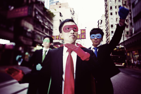 businessmen in superhero masks  