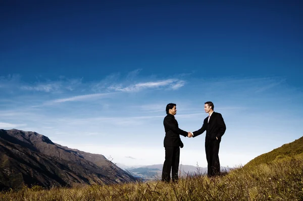 Businessmen Handshake at Mountains — Stock Photo, Image