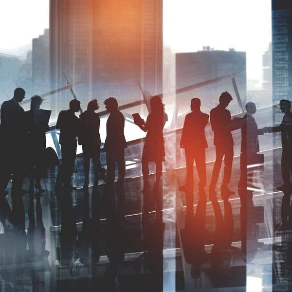 Silhouettes of business people — Stock Photo, Image