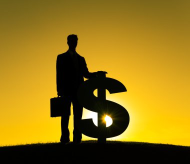 Dolar işareti olan iş adamı