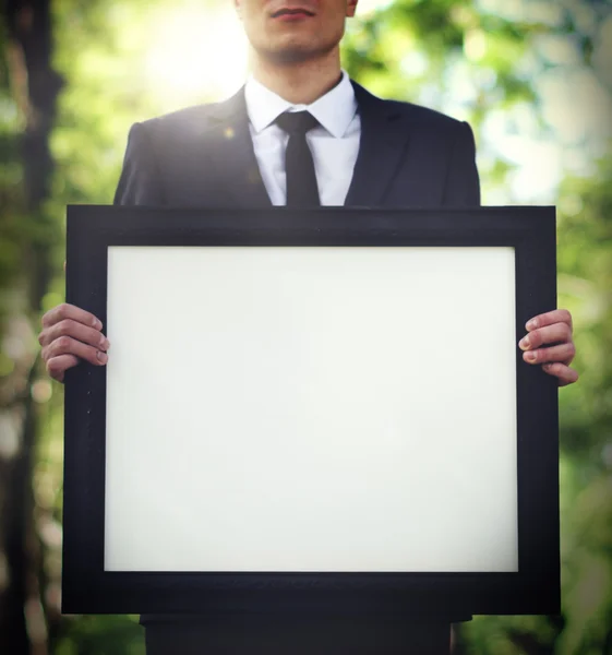 Businessman Holding Picture — Stock Photo, Image