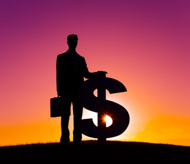 Dolar işareti olan iş adamı