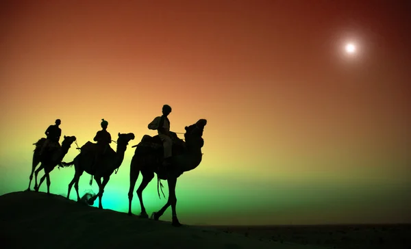 Indian Men Riding Through Desert — Stock Photo, Image