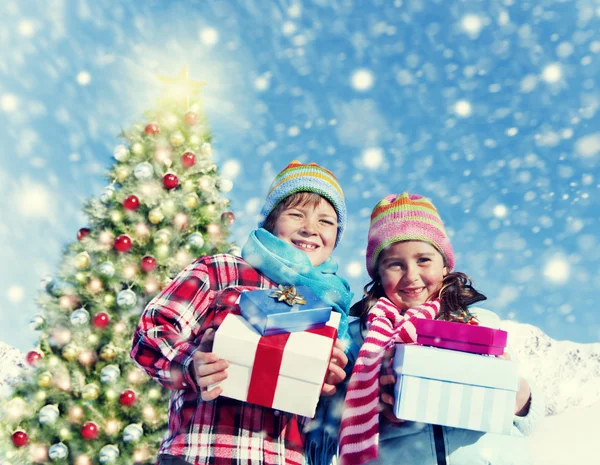 Children with gift boxes — Stock Photo, Image