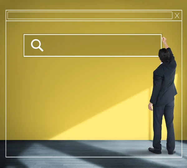 Businessman stands near wall — Stock Photo, Image