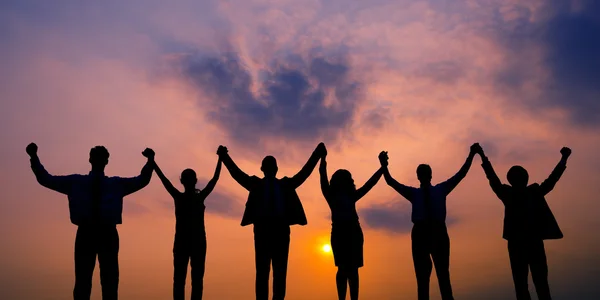 Business people rising hands up together — Stock Photo, Image