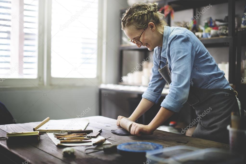 Woman Rolling Clay Concept