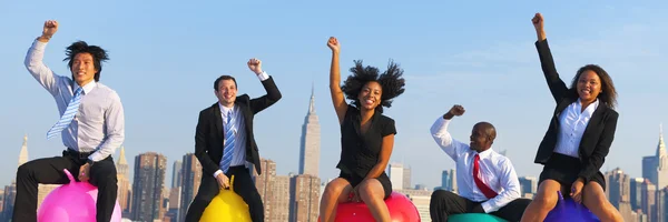 Diversity people with hoppity horses — Stock Photo, Image