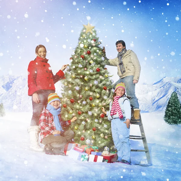 Beautiful Family decorating Christmas tree — Stock Photo, Image